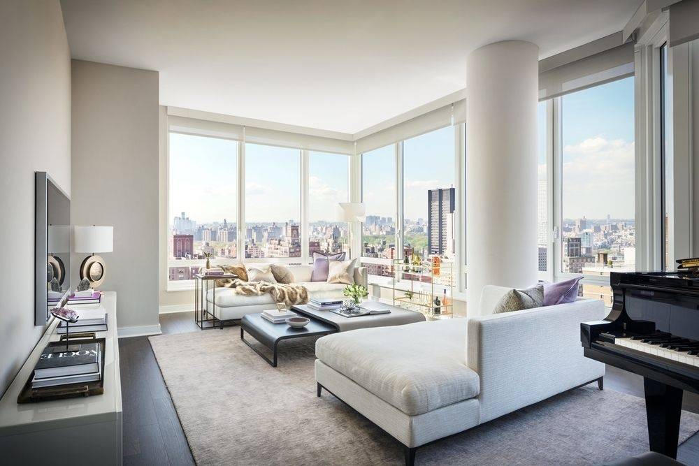 UES Spacious Corner 3 Bedroom, 3.5 Bath with high ceilings, oversized windows, an eat-in kitchen, and southern & eastern exposures with views of the East River. In unit washer and dryer.