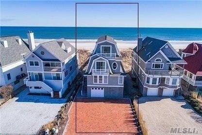 DUNE ROAD OCEANFRONT This totally updated, light filled oceanfront home, located in a protected part of Dune Road, features 3 Levels and is approx.