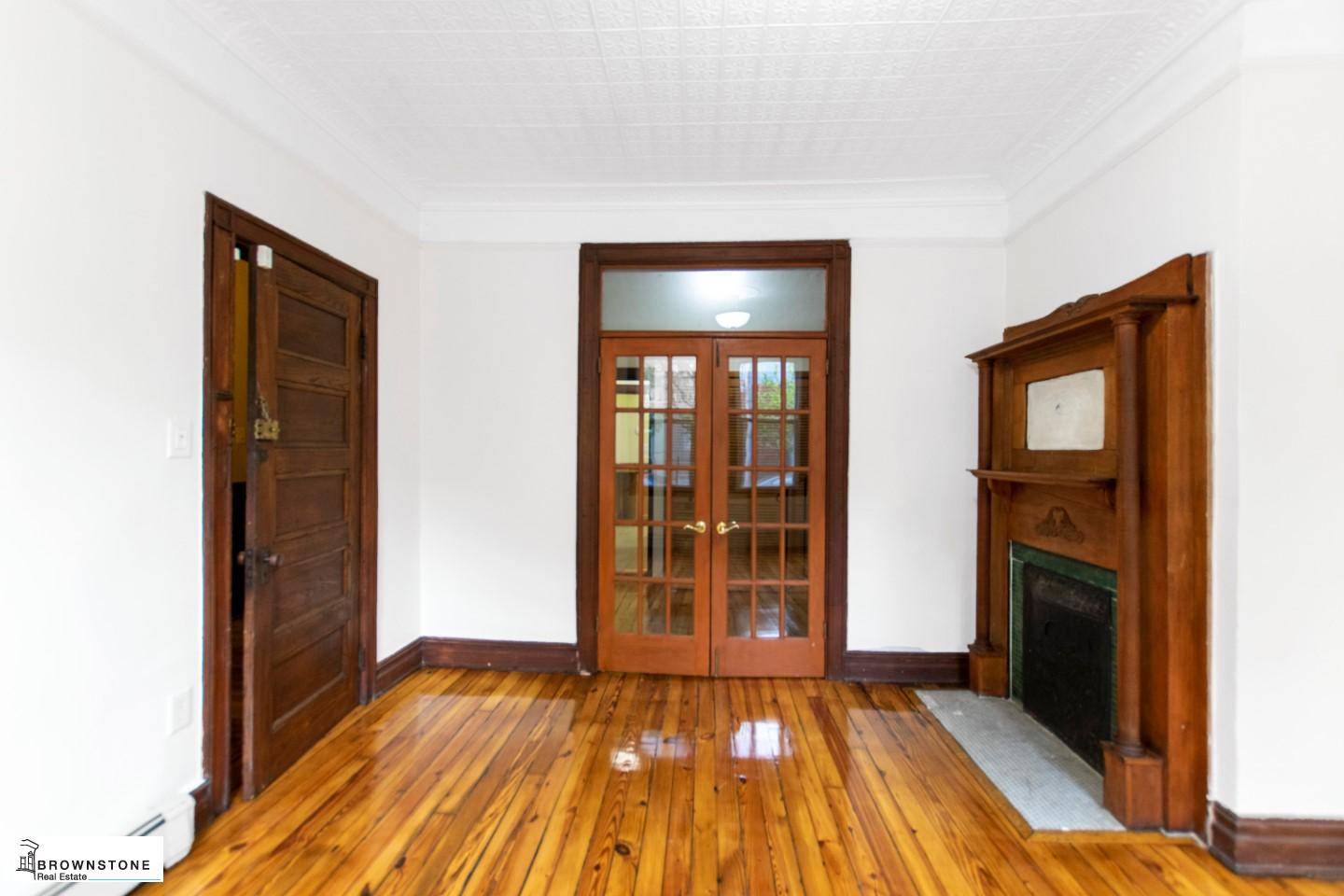 This is lovely three bedroom, two bathroom triplex in Carroll Gardens with a garden.