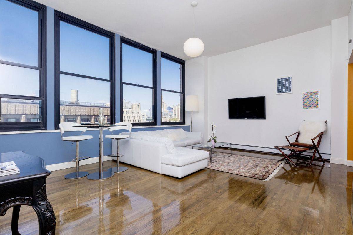 Mint High Floor Loft-like Modern One Bedroom Plus Home Office with 12 ft Ceilings & Sky Views from a Wall of Windows in Doorman Building in Greenwich Village/Noho
