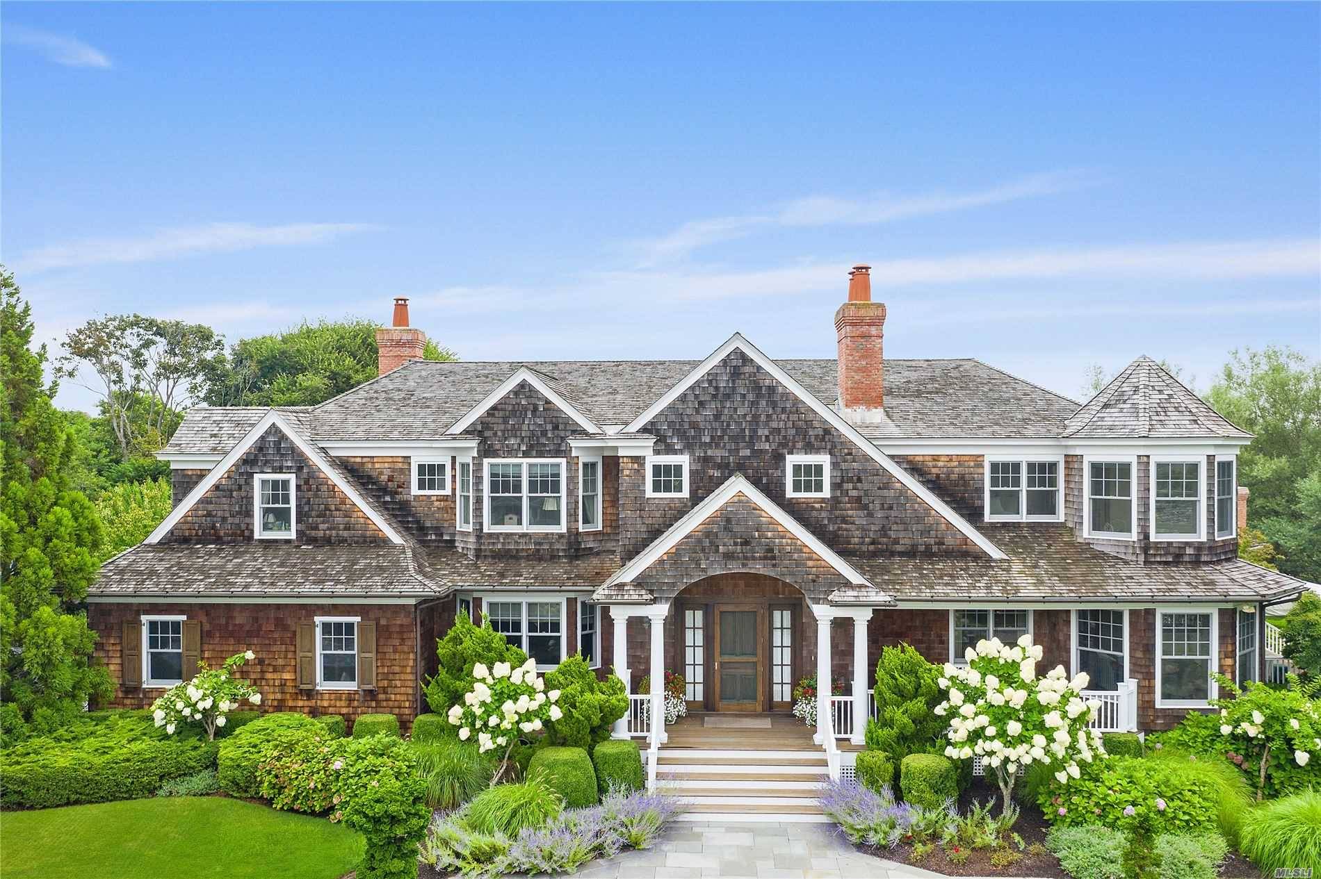 On one of the most desirable streets in the estate section of Quogue, this custom built home offers luxurious living in a private setting.