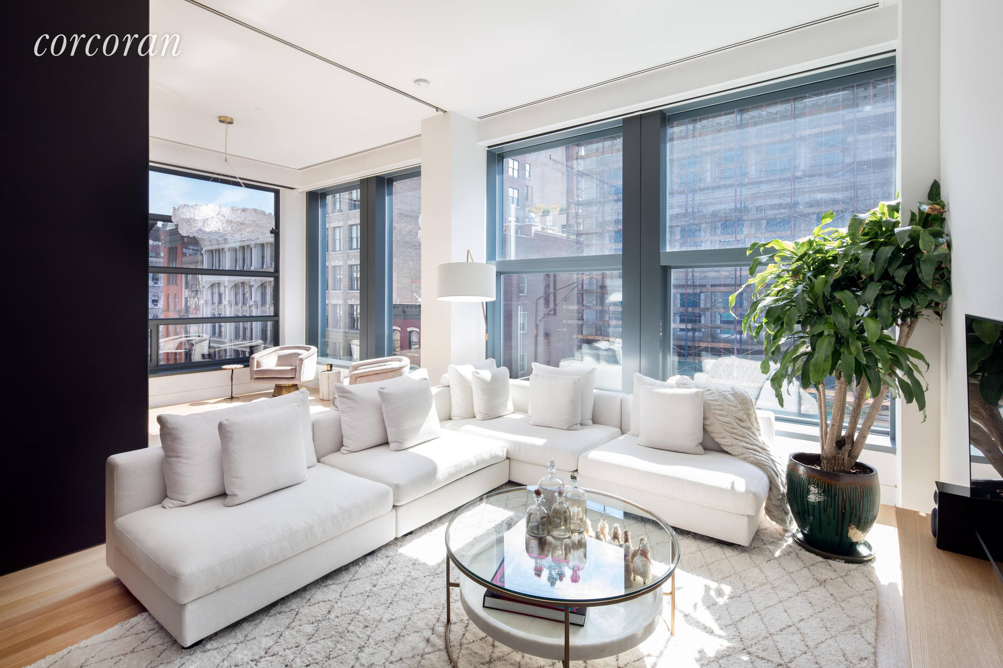 Expansive 2 bed 2 bath corner unit boasting 11 ceilings, floor to ceiling windows with motorized window panes and shades, white oak flooring, limitless custom cabinetry and an entertainers dream ...