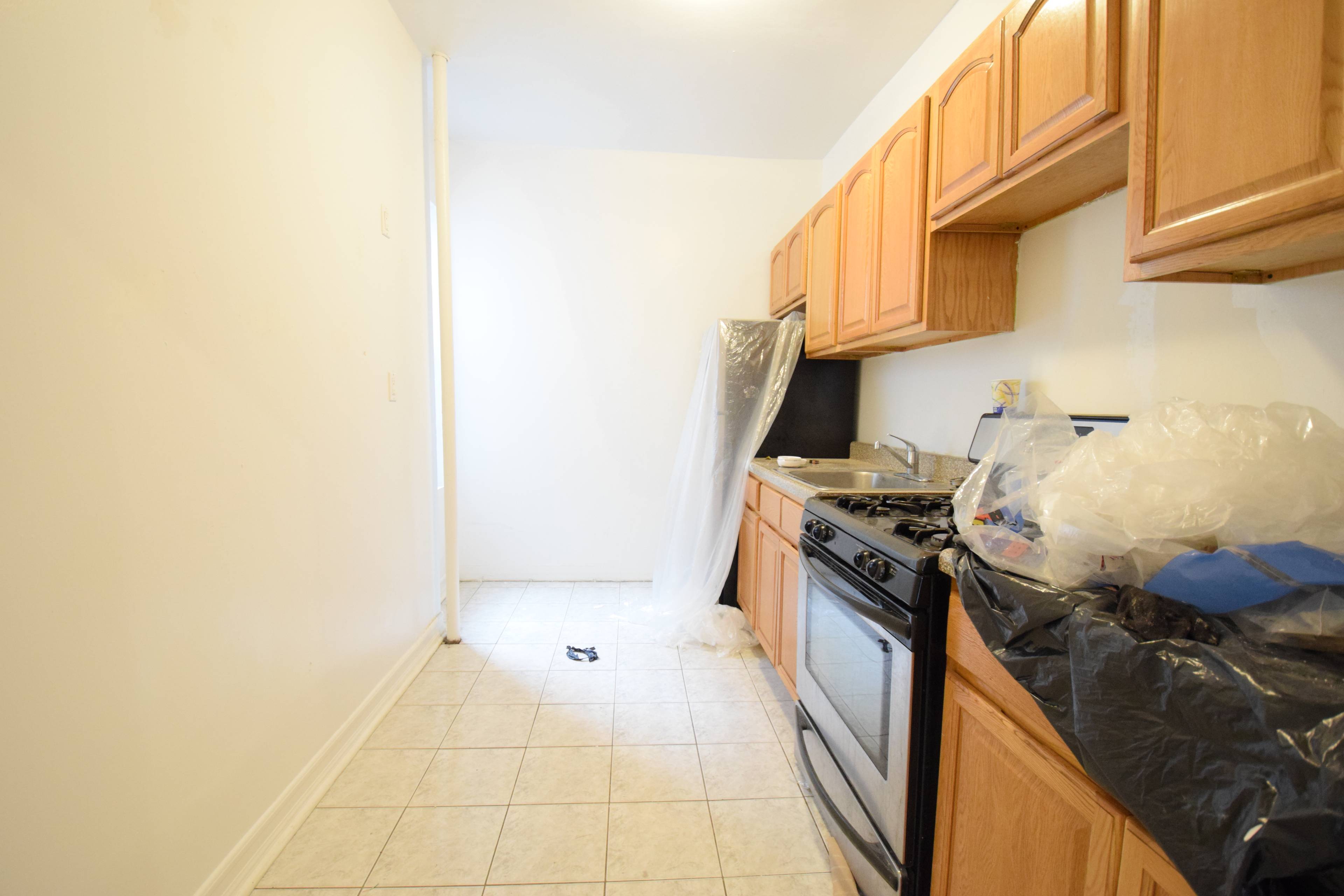 Crown Heights 1 bedroom. Up 2 flights of stairs you enter into this large 2 bedroom in the process of being freshly painted.