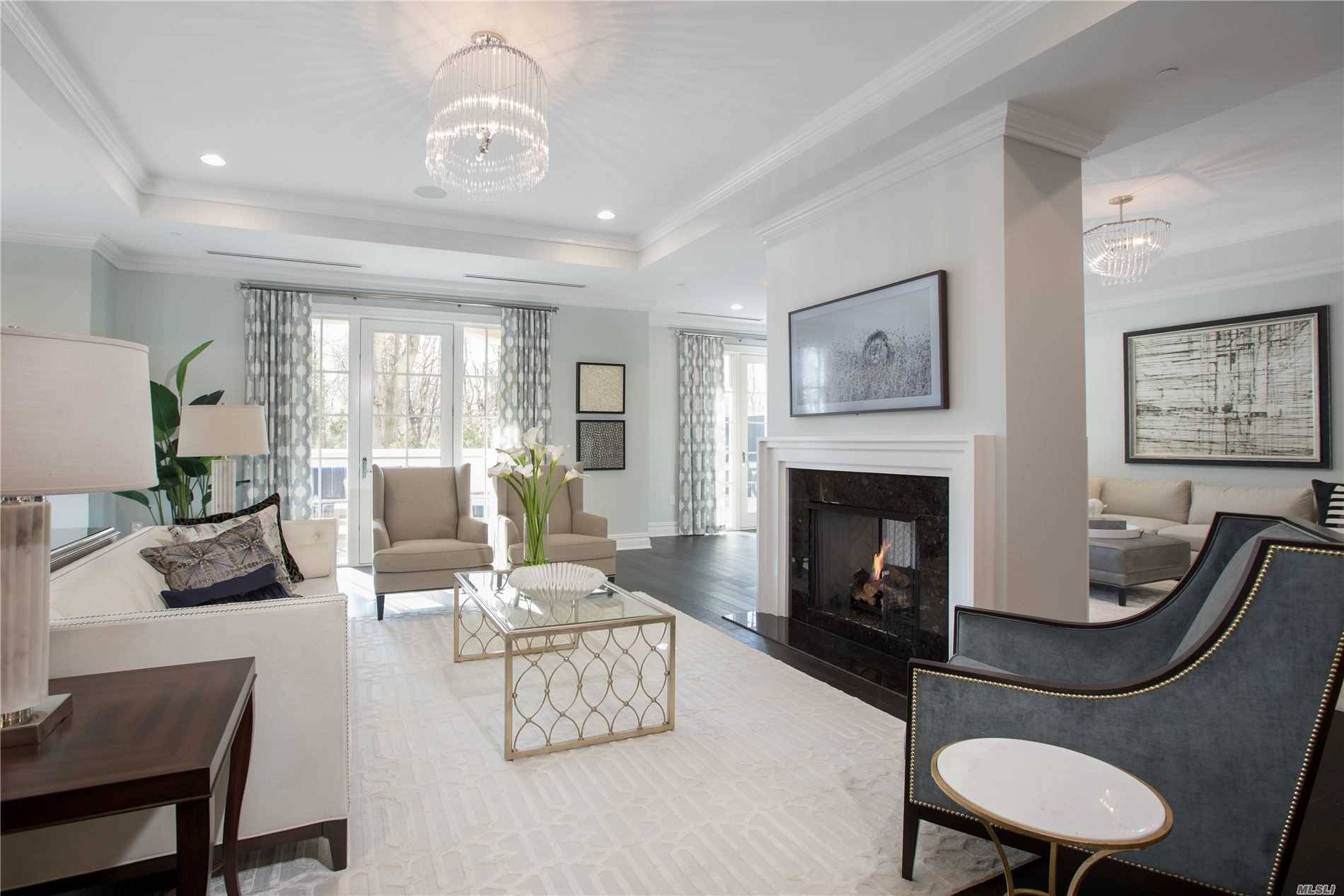 Expansive 3 bedroom, 3. 5 bathroom residence at The Ritz Carlton North Hills features a beautiful entry foyer that leads to a spacious living area with den, hardwood floors, dual ...