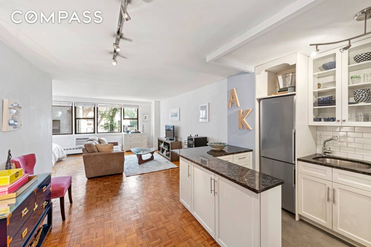 Extremely quiet, extra large, alcove studio with views over the gardens in a full service coop located at the cusp of Gramercy, and the East Village.