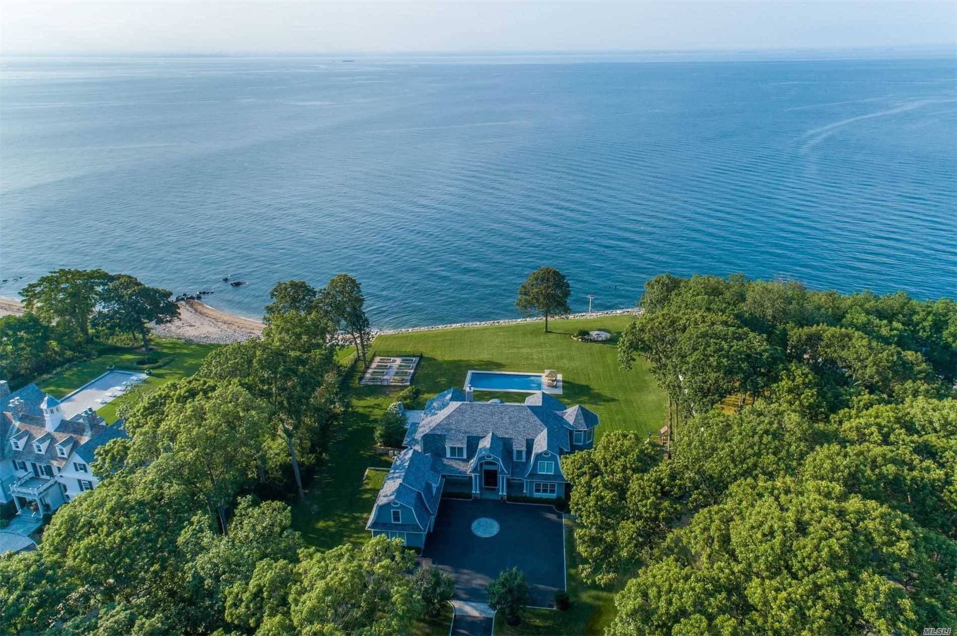 Young, exquisite 6 bedroom country colonial beautifully situated on the Long Island Sound.