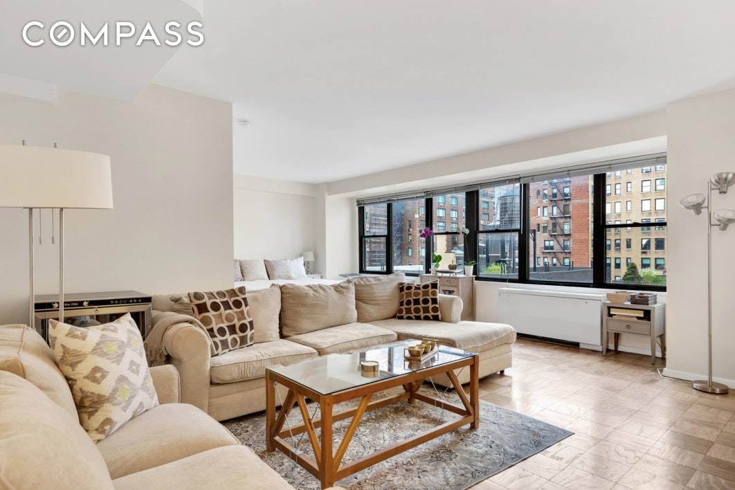 PRICE CORRECTION ! This spacious Alcove Studio in full service building in Carnegie Hill is perfect for an Owner Investor User or 1031 exchange !