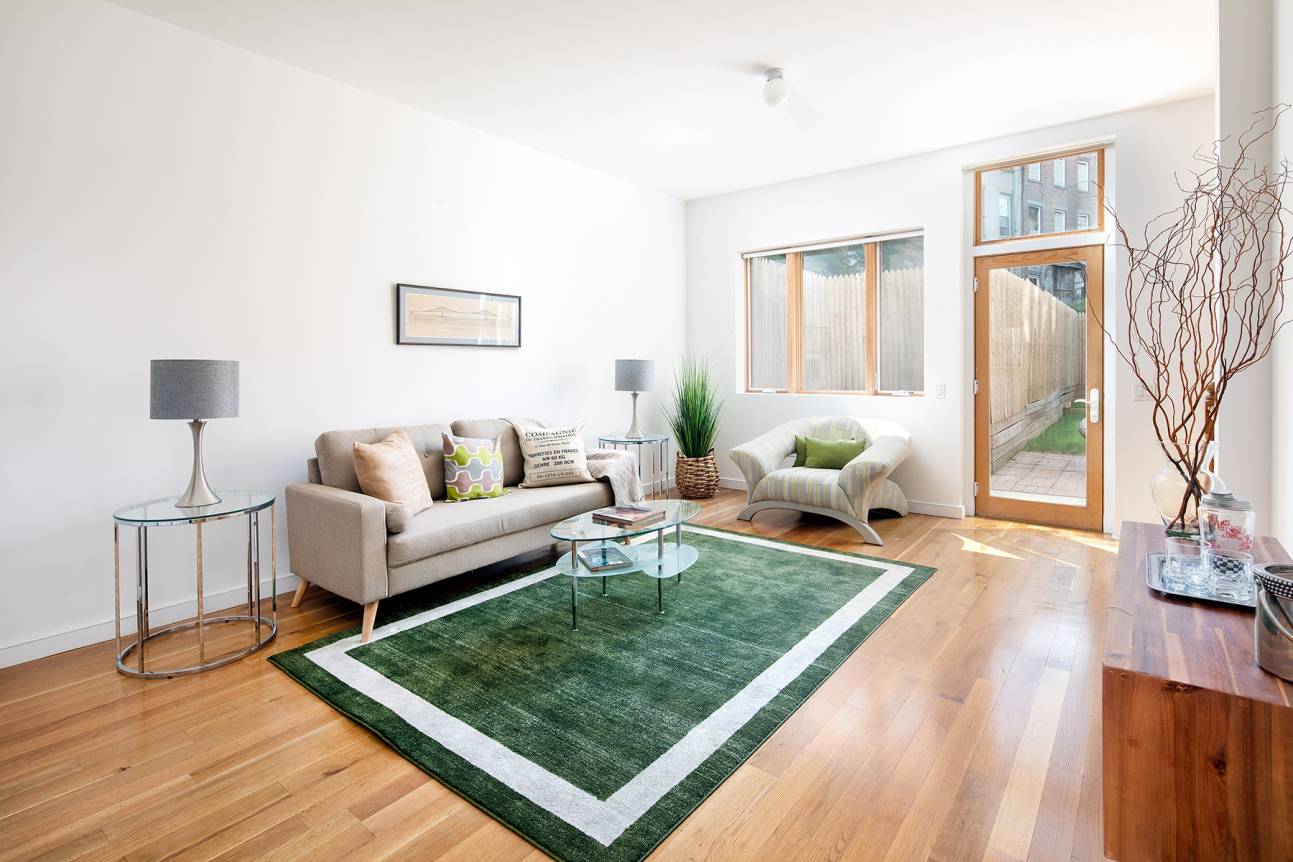 Make your private outdoor space dreams come true in this sprawling one bedroom, two bathroom duplex home in an outstanding Clinton Hill condominium.