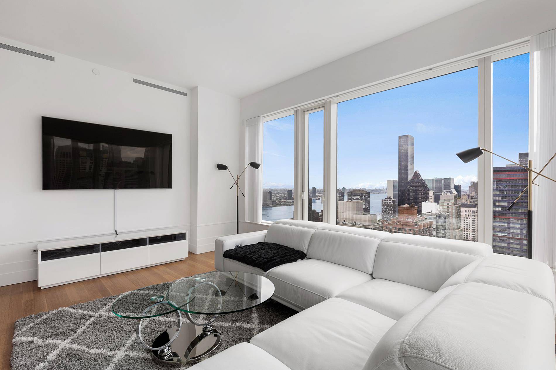 THIS APARTMENT OFFERS ON SITE AUTOMATED PARKING SPACE Spacious 1, 736 square foot corner residence with panoramic views of south and west skyline through oversized windows.