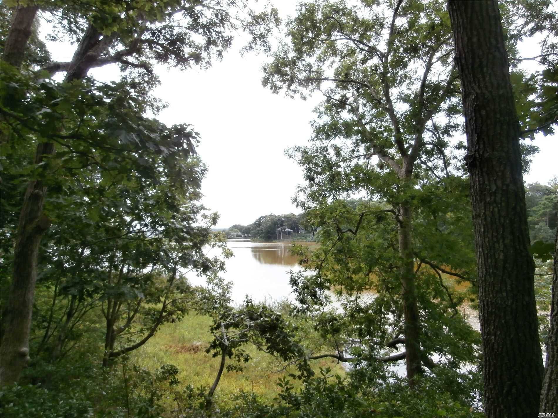On Marion Lake. 1 Acre Lake Front Wooded Property with 1960s Ranch Home and Detached Garage.