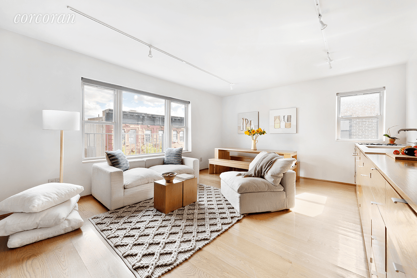 Perched on the top floor of a coop on one of SoHo's most charming blocks is this architecturally stunning apartment boasting three exposures, city views, and abundant natural light.