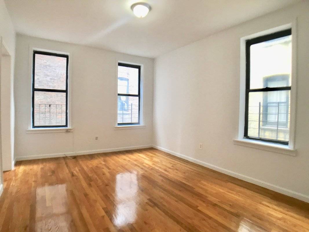 This impressive 3 bedroom apartment is located in Washington Heights.
