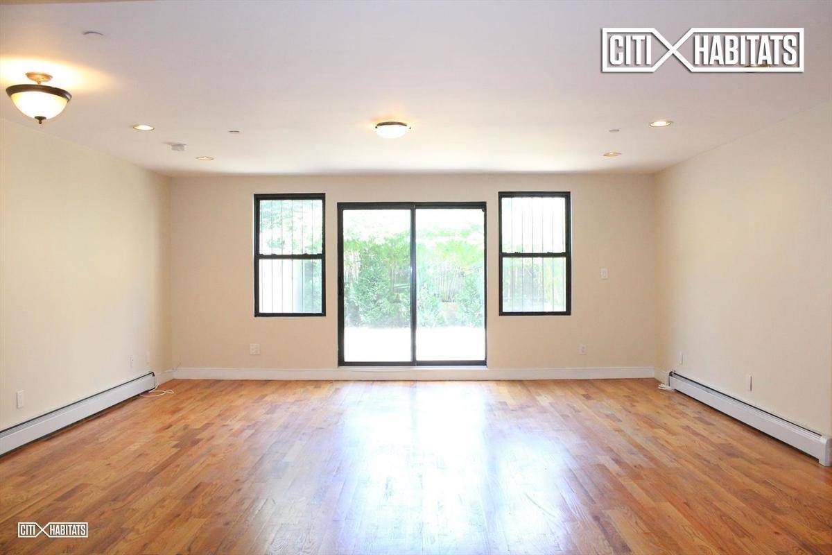 SPACIOUS 2400 SF modern 3 bedroom 2 full bath and 2 half bath TRIPLEX with private yard and all the trimmings in Stuyvesant Heights !