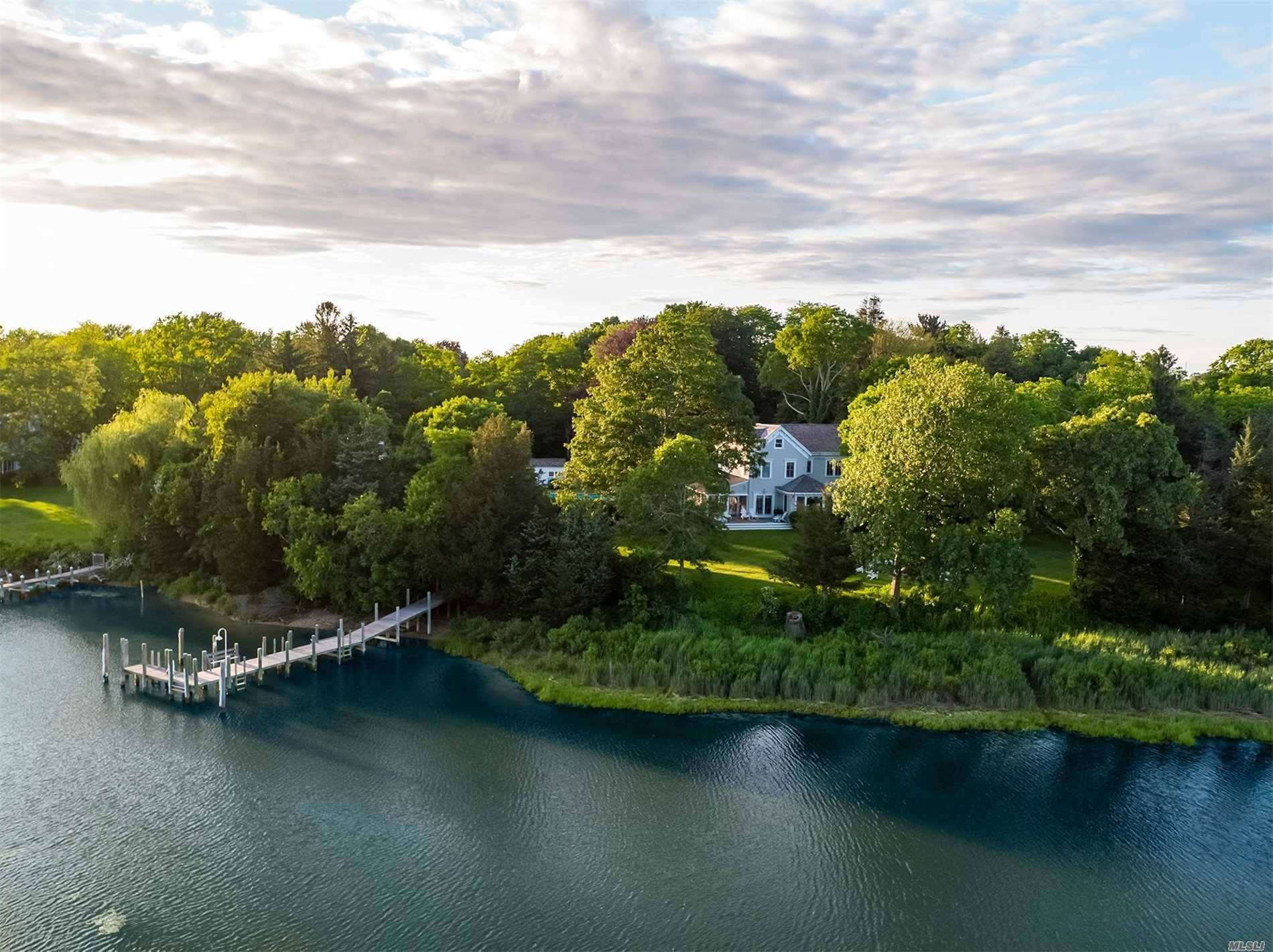 This magical waterfront homestead encompasses over 5 acres, 421 ft of water w.