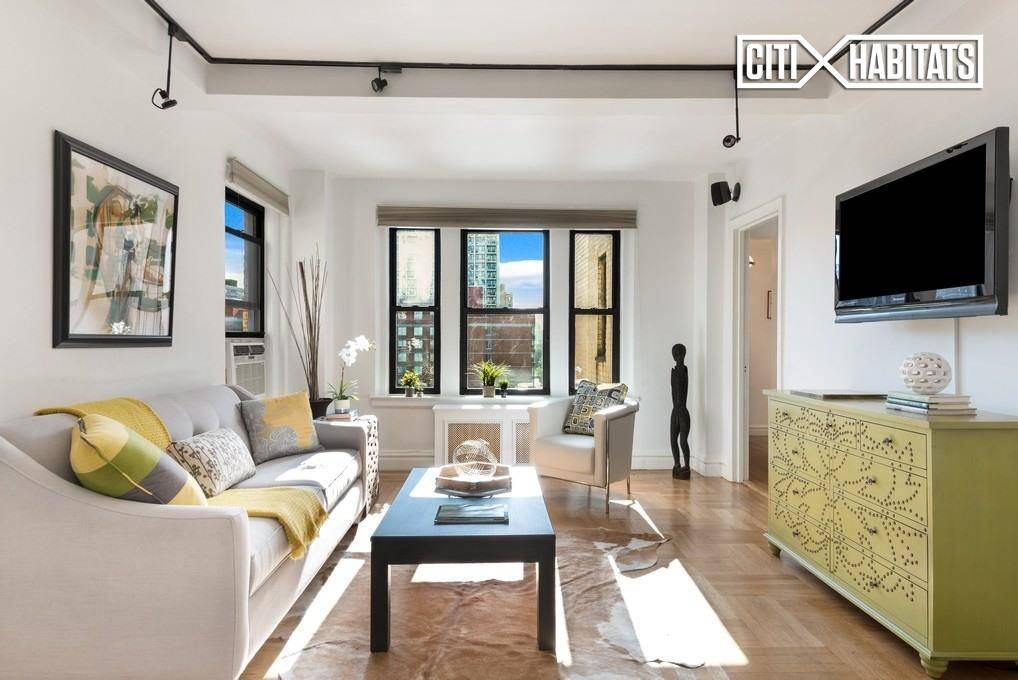 This over sized prewar Jr 4 apartment offers ample natural light flowing from three exposures, old world charm and modern finishes throughout.