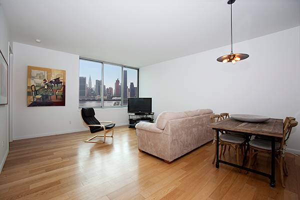 Large 1 bed/1.5 bath with breath-taking city & water views in a luxury new condo building