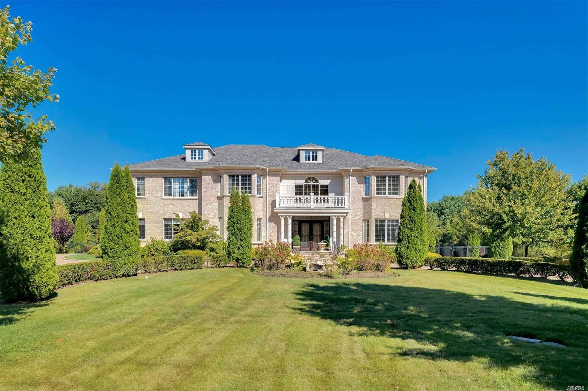 Reminiscent of a French villa, this elegant, sun swept 7, 100 square foot, six bedroom, five and a half bath, brick Colonial is a perfect venue for gracious Gold Coast ...