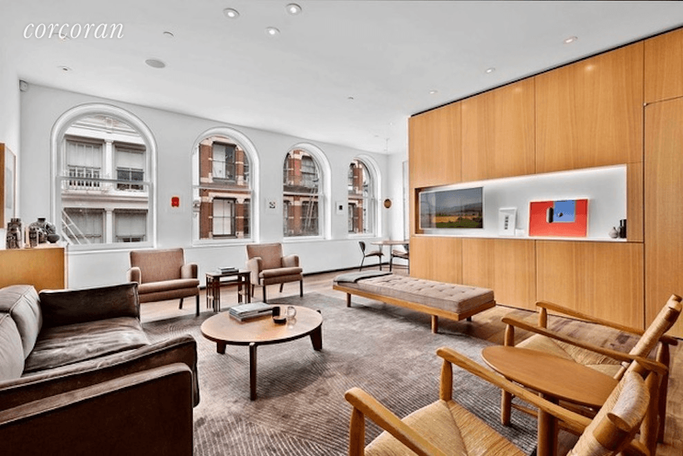 Custom designed beautifully appointed and architecturally significant classic full floor SoHo loft.