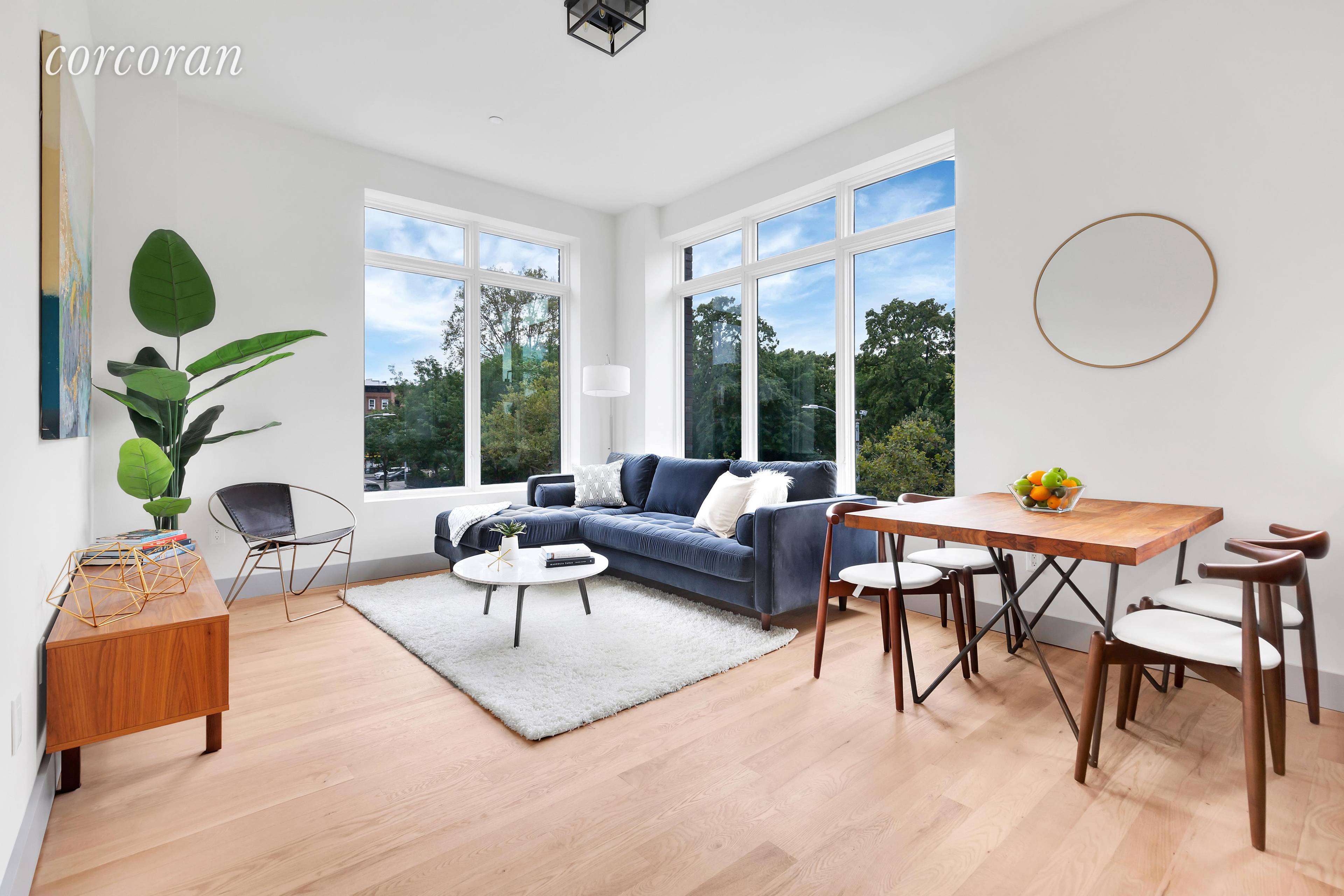 The park feels like a lush front lawn in Residence 2A, a well designed corner 2BR 2BA 977 square foot home with treetop and park views from every single room.
