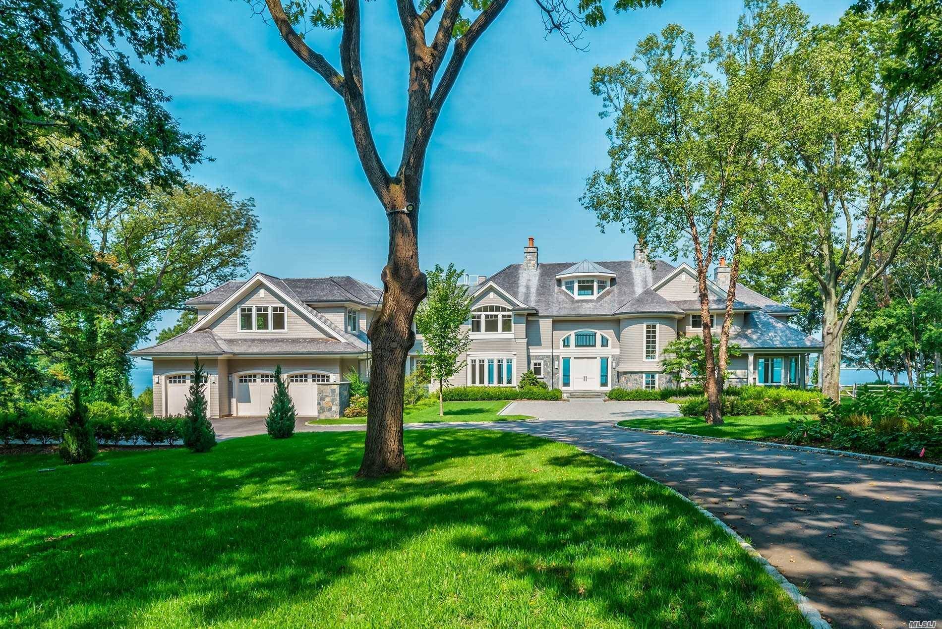 Set privately on 3. 38 acres high above sea level with 400' of sandy coastline, this 16, 000 sq ft new construction smart home sets the standard for luxury.
