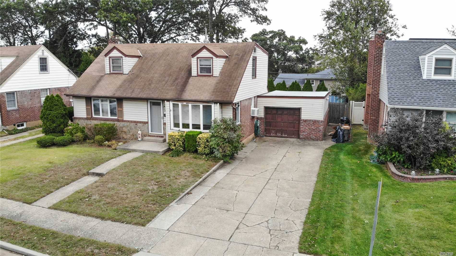 Great Opportunity To Make This One Your Own, This Wide Line Cape Is Set On A Beautiful Tree Lined Street With A Large Backyard, 200 Amp Service, and Central Vac.