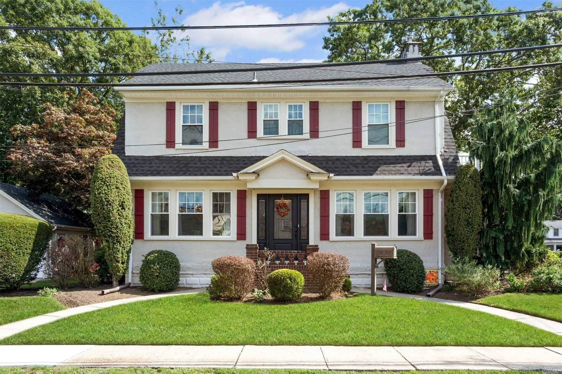 Spacious, sunny and elegant Colonial on a very quiet block.