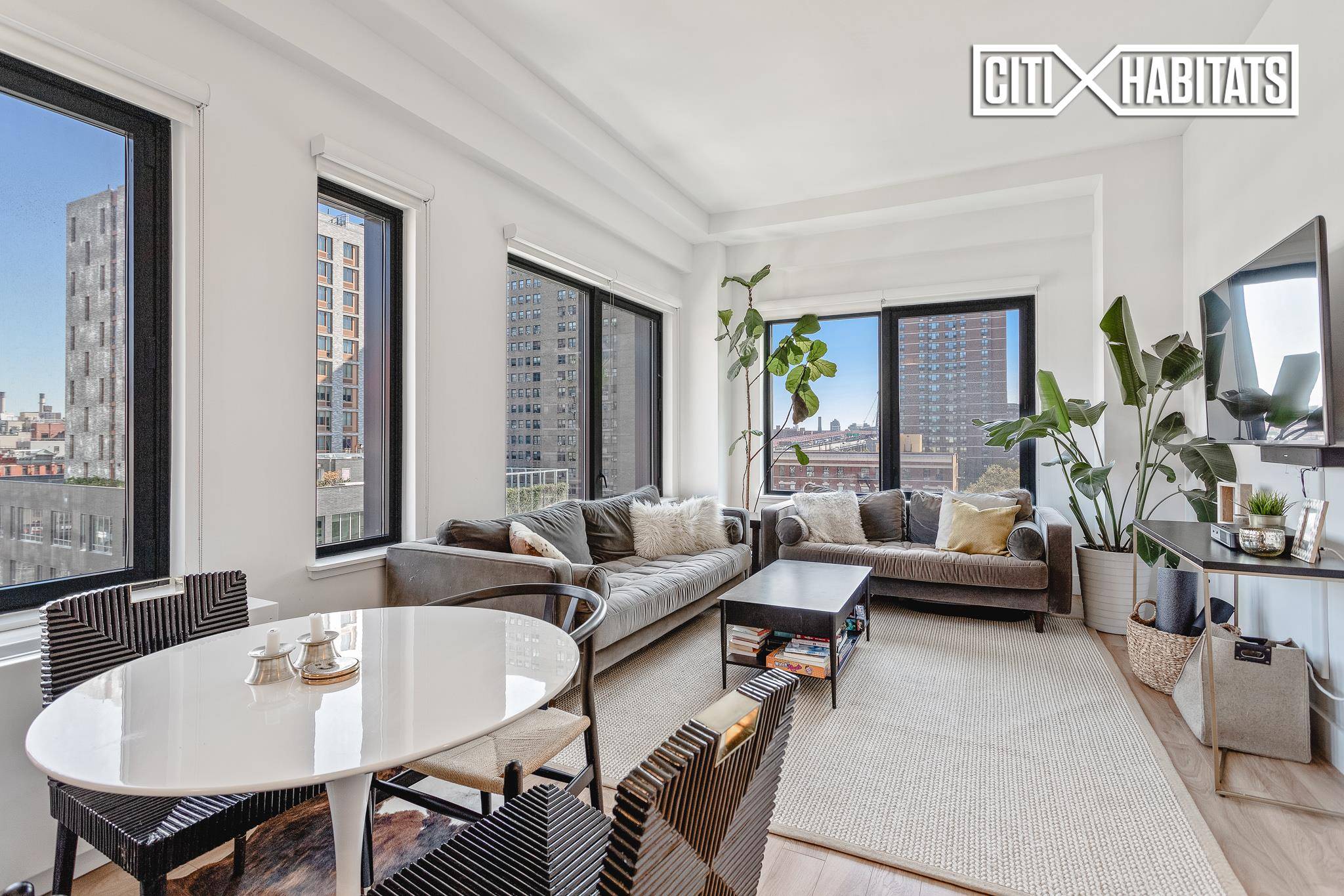 Sprawling and luxurious two bedroom two bathroom apartment with jaw dropping city views in a most coveted Lower East Side building and location !