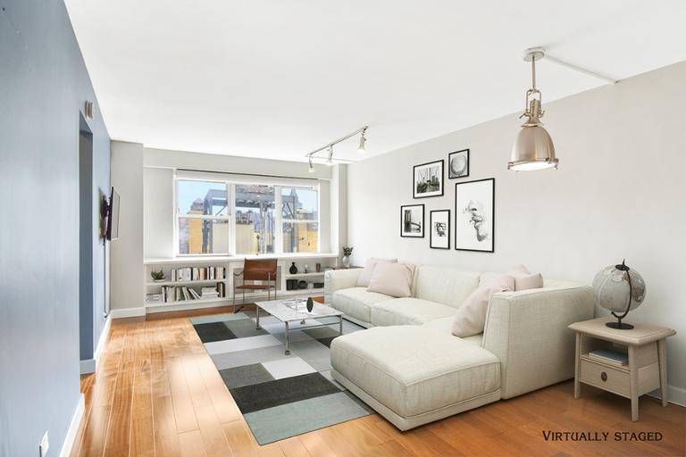 Sunny in the day and twinkly at night, this turn key, two bedroom, one bath West Village apartment boasts views throughout.