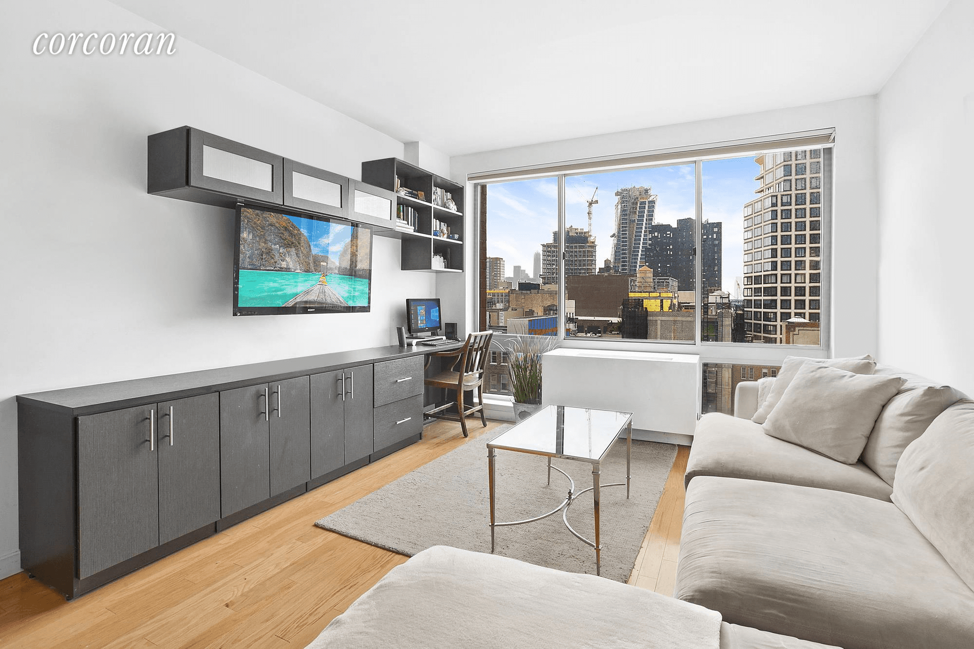 This bright and pristine high floor one bedroom home is located at 555 West 23rd Street, a full service, luxury condominium.