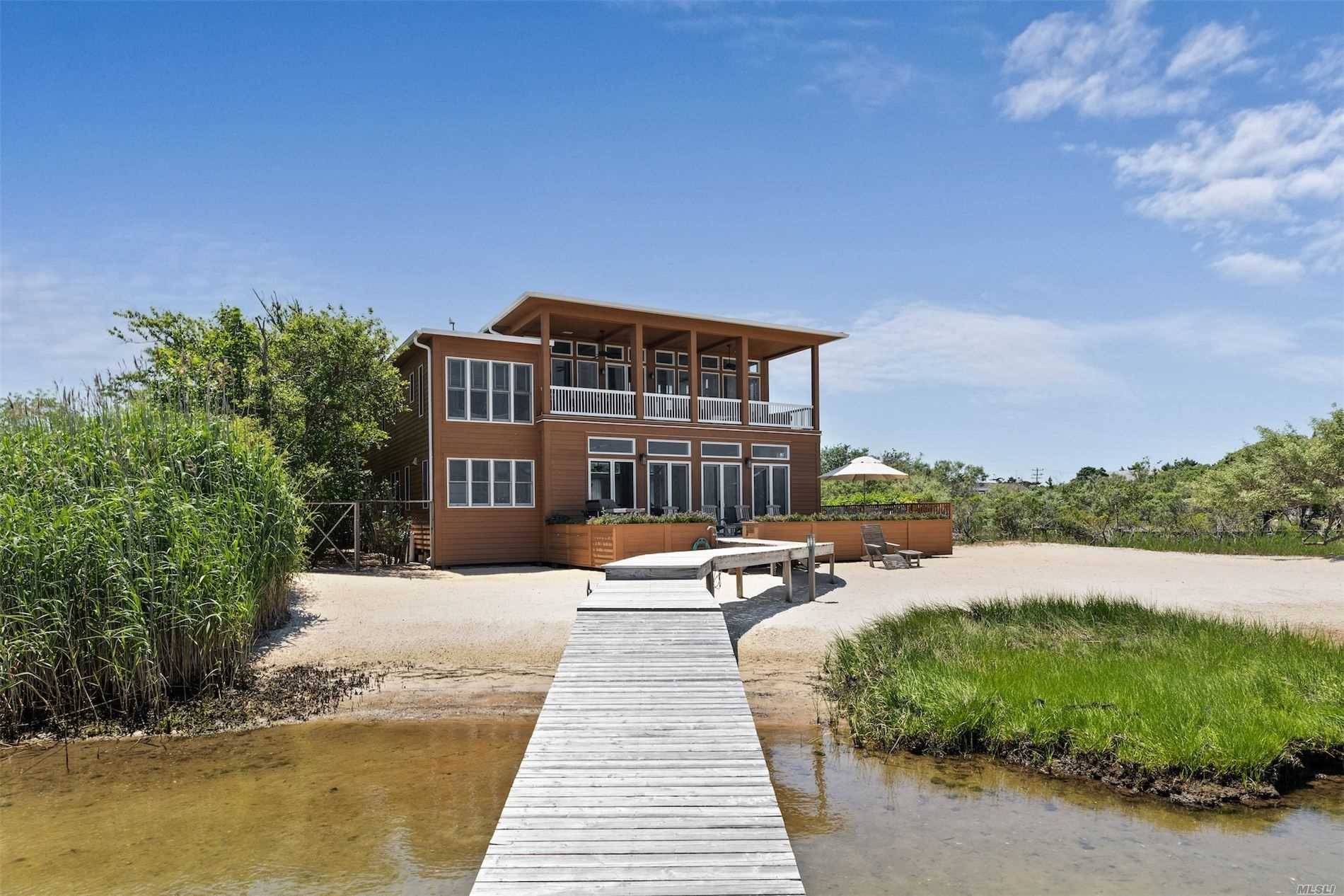 This spectacular Saltaire home, located on the waterfront of Clam Pond Cove, the protected jewel which is part of the Great South Bay, has everything the discerning buyer would want ...