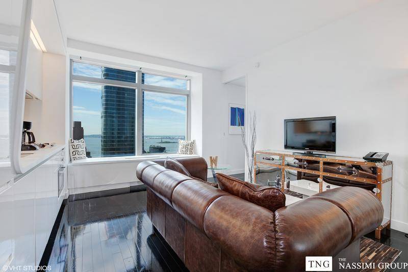 Tenant in place. A chic high floor condo graced with stunning views of the Upper Bay and the Statue of Liberty, this 1 bedroom, 1 bathroom home is a study ...