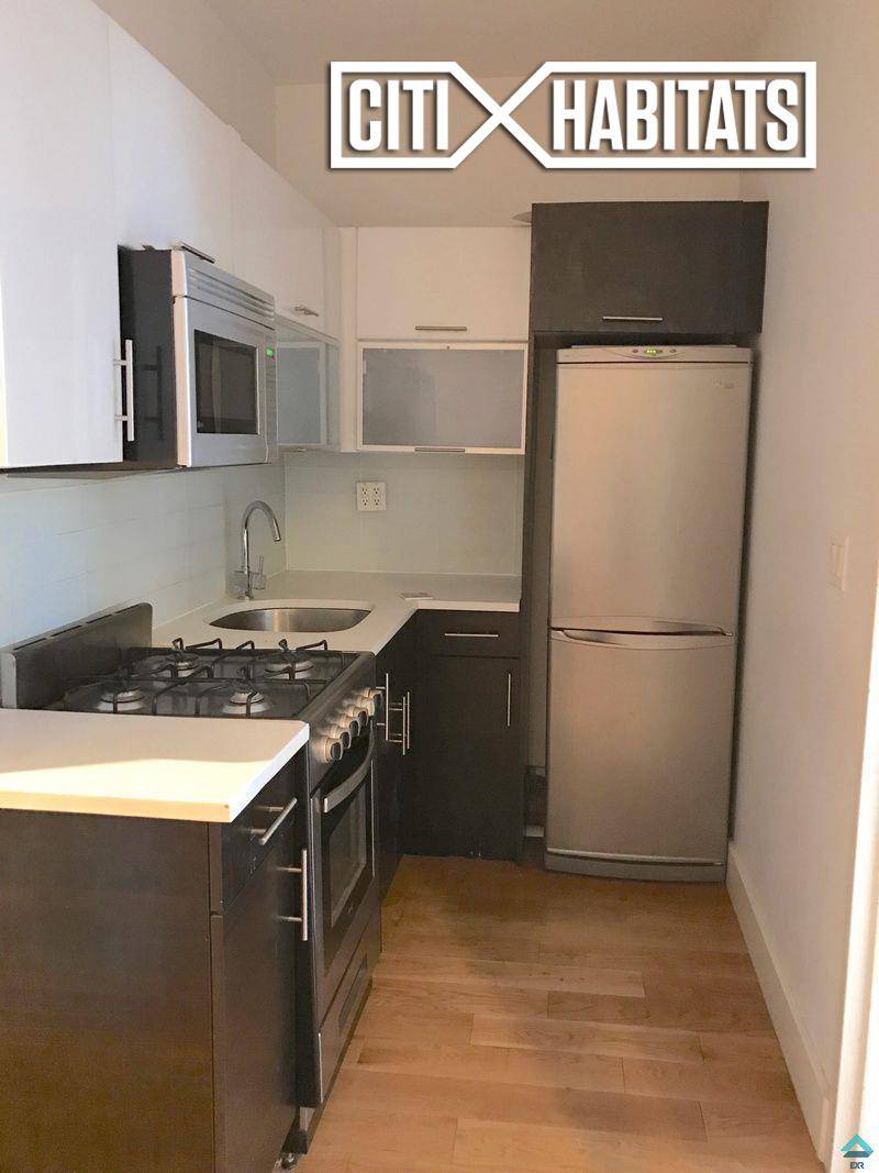 Prime Location ! Large 4 Bedroom ApartmentExposed BrickLaundry in BuildingModern Sleek Finishes Pictures are of a similar unit in the building.