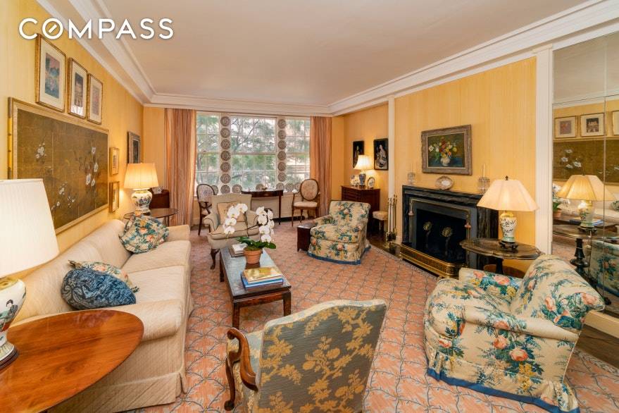 This distinguished Park Avenue home features a unique central gallery and views of a beautifully landscaped garden.