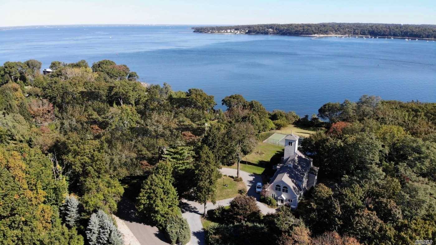 Magnificent waterfront 4, 059 SF colonial on 2 acres situated in the prestigious Village of Sands Point.