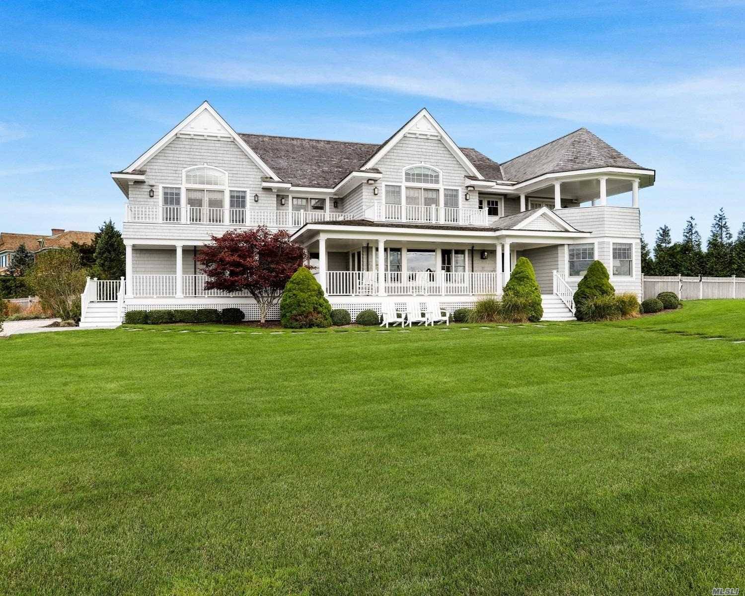 Immaculately maintained 7BR 5 full 2 half BA Postmodern w unobstructed water views of Moriches Bay.