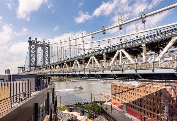 This condo boasts the most unique, iconic bridge views you can only find in Dumbo.