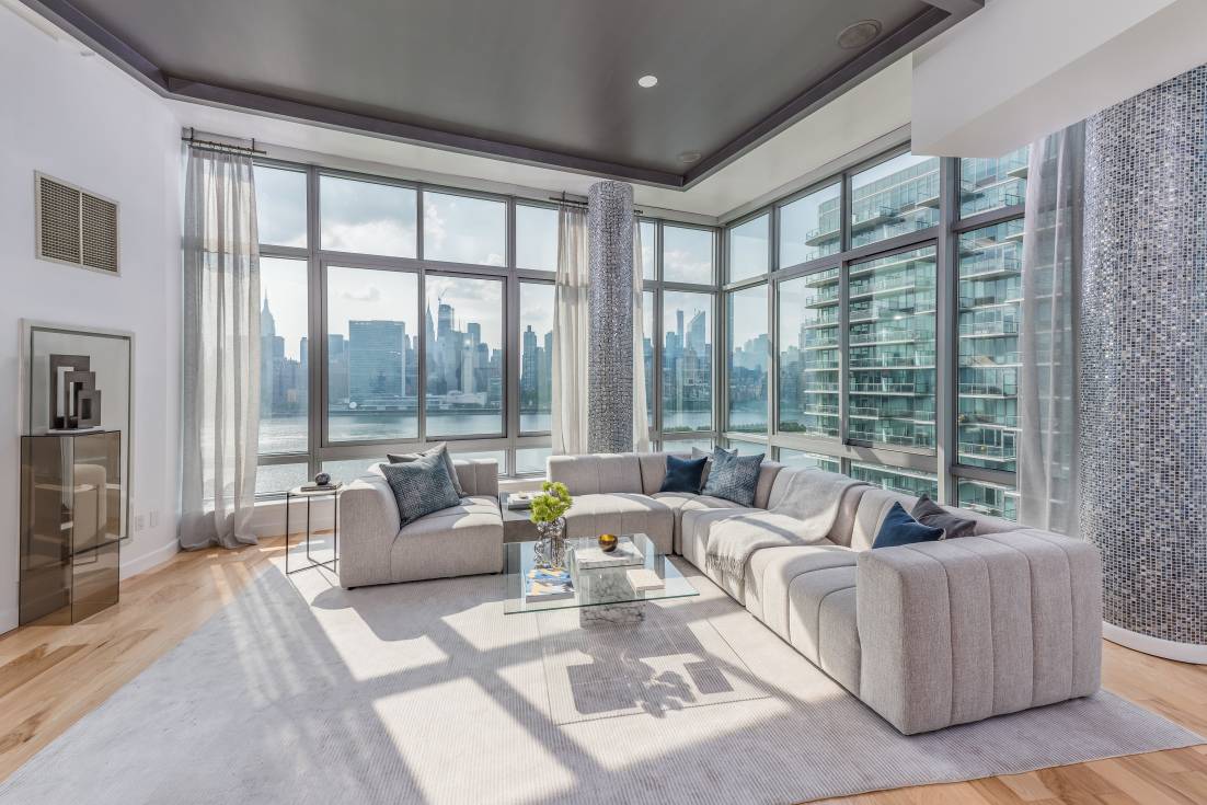 This enviable one of a kind corner duplex penthouse has it all !