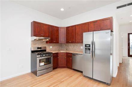 Spacious 2 Bedroom Unit with TWO Private Balconies, In Unit Washer and Dryer, and Central AC in Williamsburg's Prime Northside.