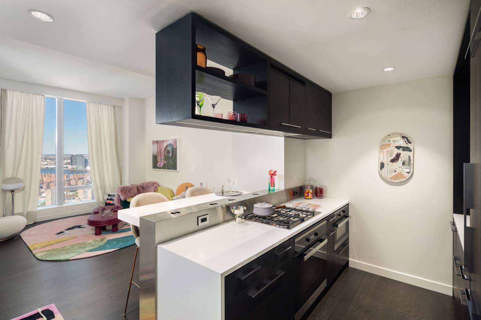 Residence 33E is a 694 square foot one bedroom, one bathroom with an open gourmet kitchen and breakfast bar.