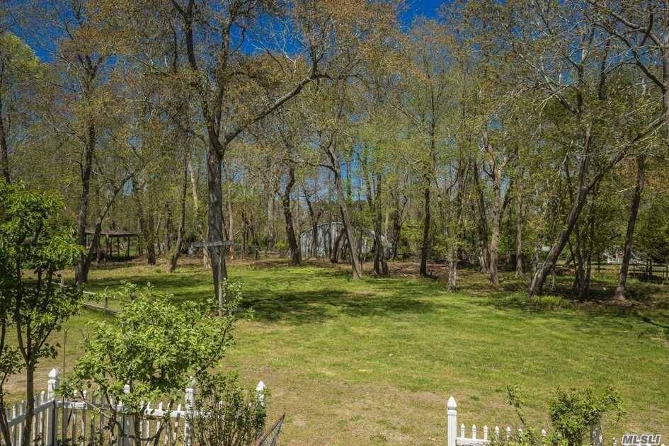 7. 1 Acre Private property Completely Secluded less than 1 Mile North of the Long Island Expressway just 2 Minutes to Manorville's Shopping restaurants conveniences, Winding Dirt Driveway Opens to ...