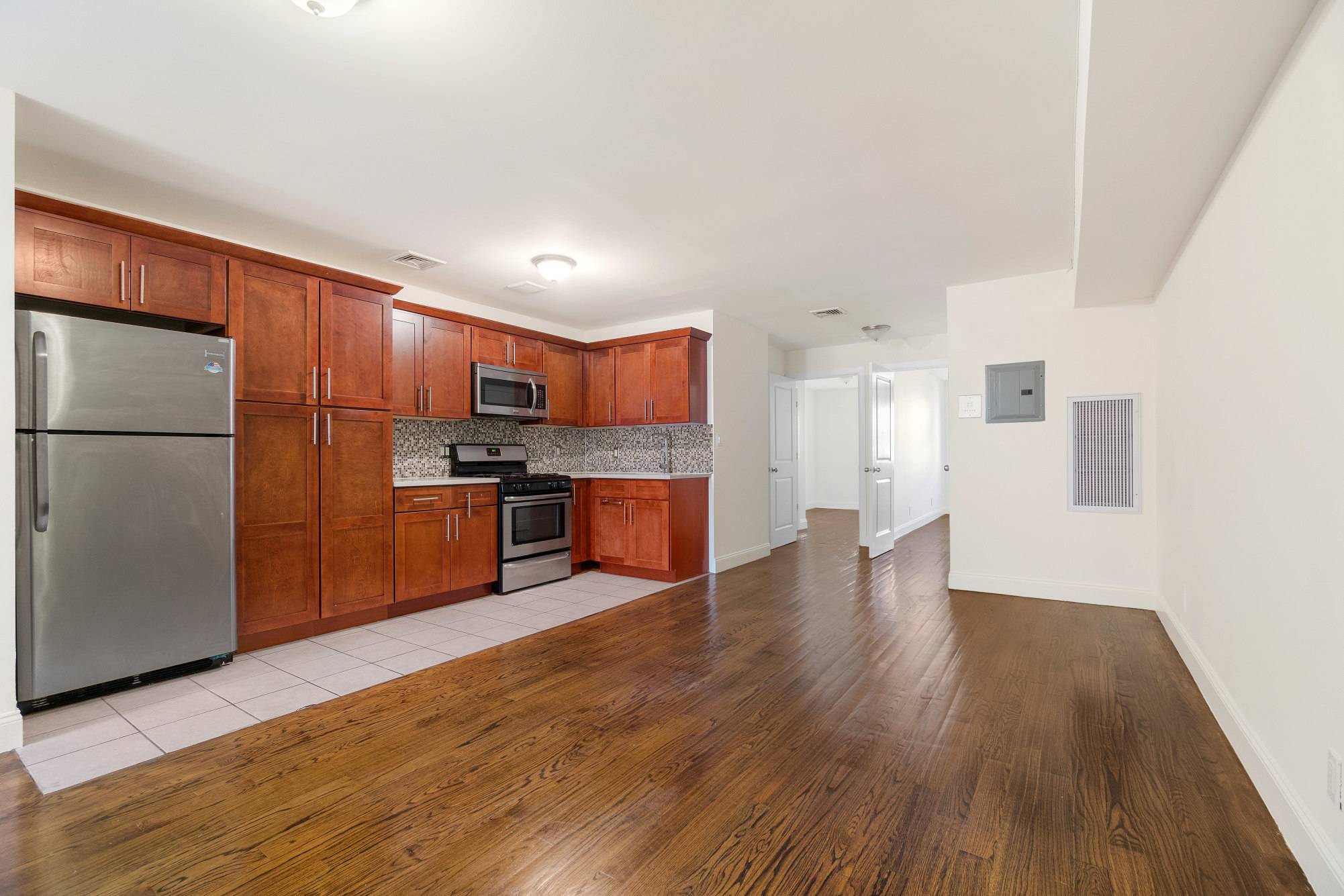 Rent Reduced for This charming 3BR 1 BA space with handsome wood flooring and open kitchen is move in ready.