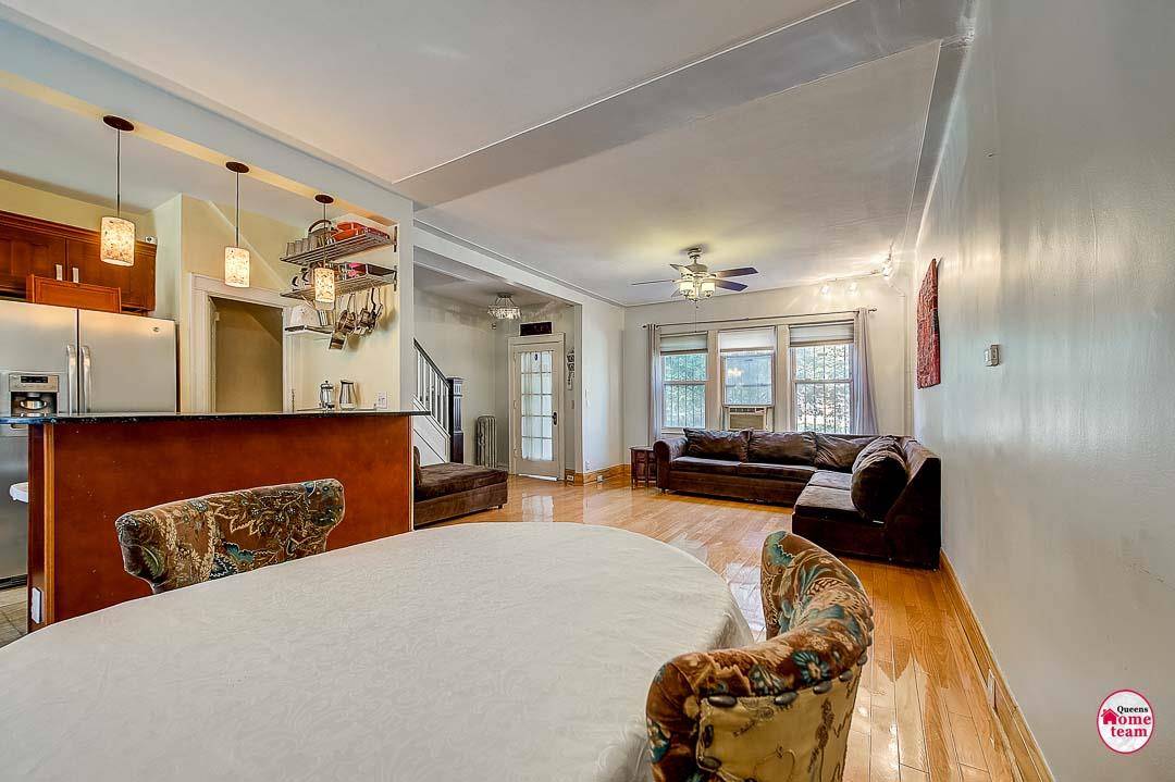 All brick single family home with finished basement and private parking in highly sought after Jackson Heights, Queens.