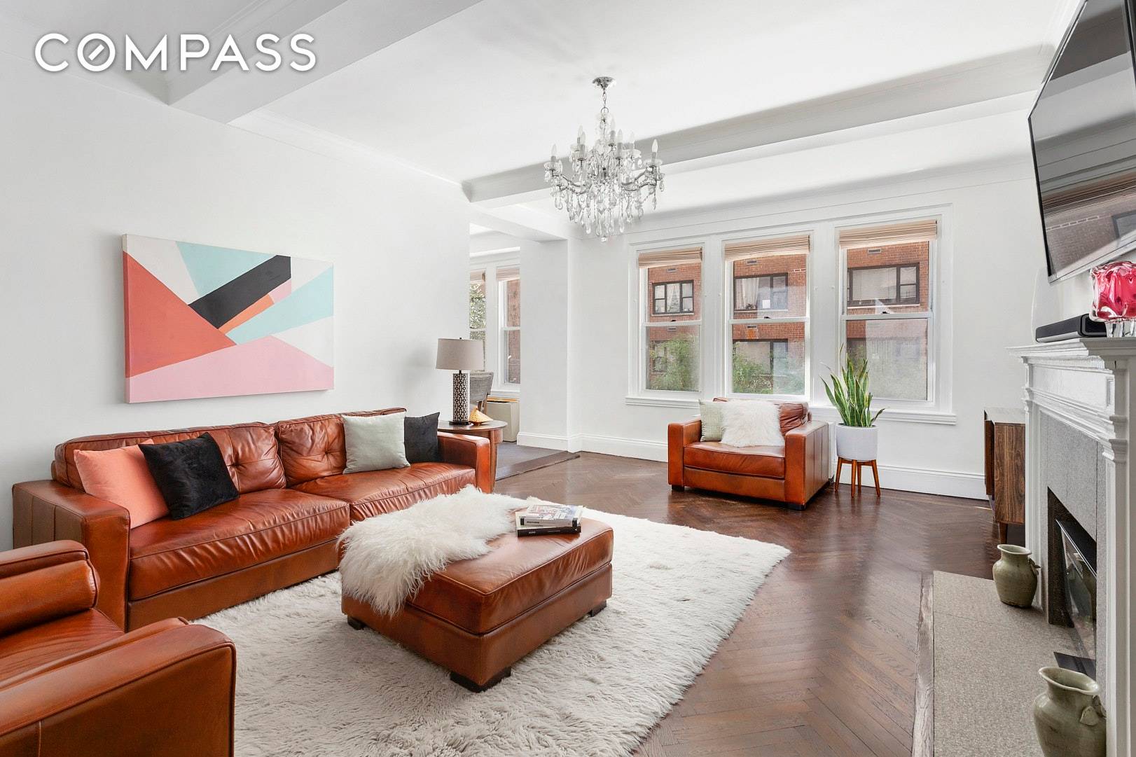 Sprawling and impeccably renovated pre war one bedroom plus windowed home office den in an architecturally significant full service cooperative steps from prestigious Sutton Place.