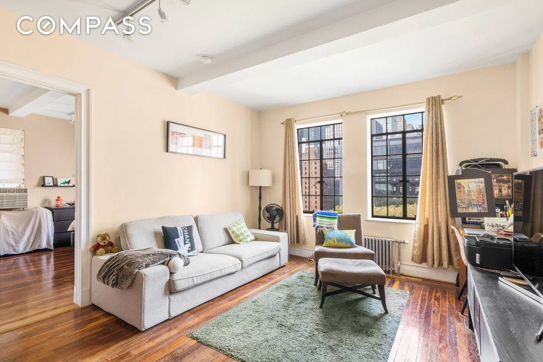 Charming 10th floor one bedroom with Western amp ; Southern exposure showcasing a view of the private Tudor City Park amp ; the Chrysler building.