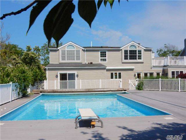 Amazing Waterfront Contemporary Home With In Ground Heated Pool And Park Like Grounds.