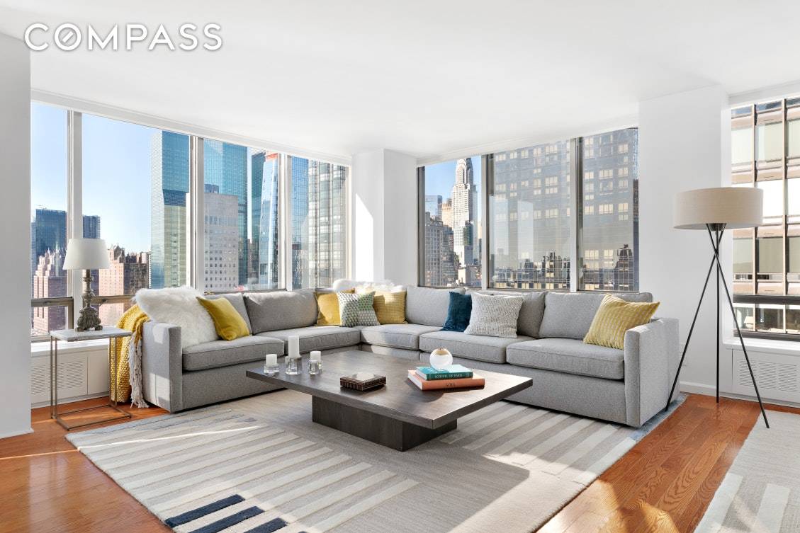 Perched high above the East River, this rarely available corner A line apartment is sun drenched with panoramic views from floor to ceiling windows.