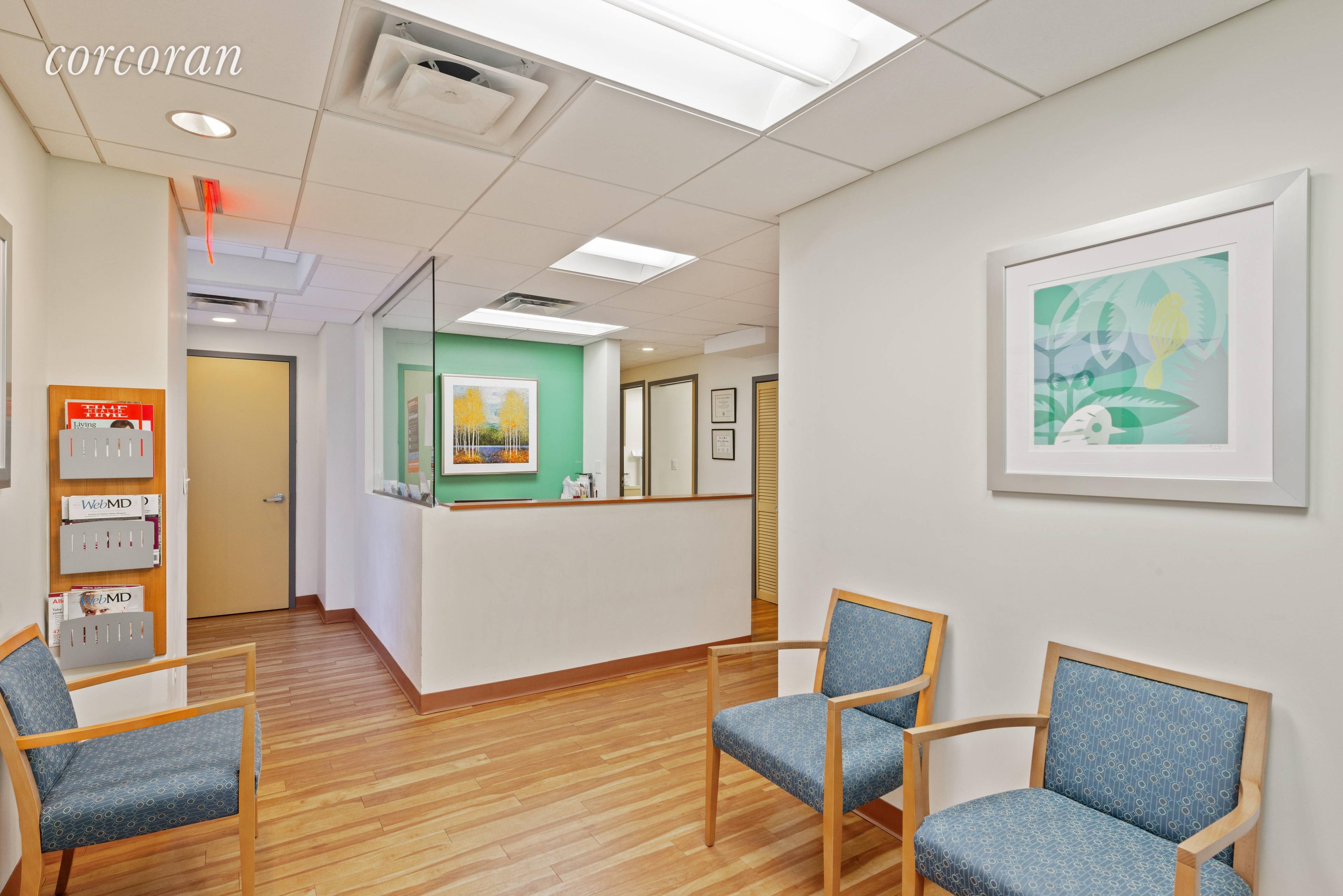 Pristine ground floor medical office featuring two exam rooms, a waiting reception area, and two administrative offices.