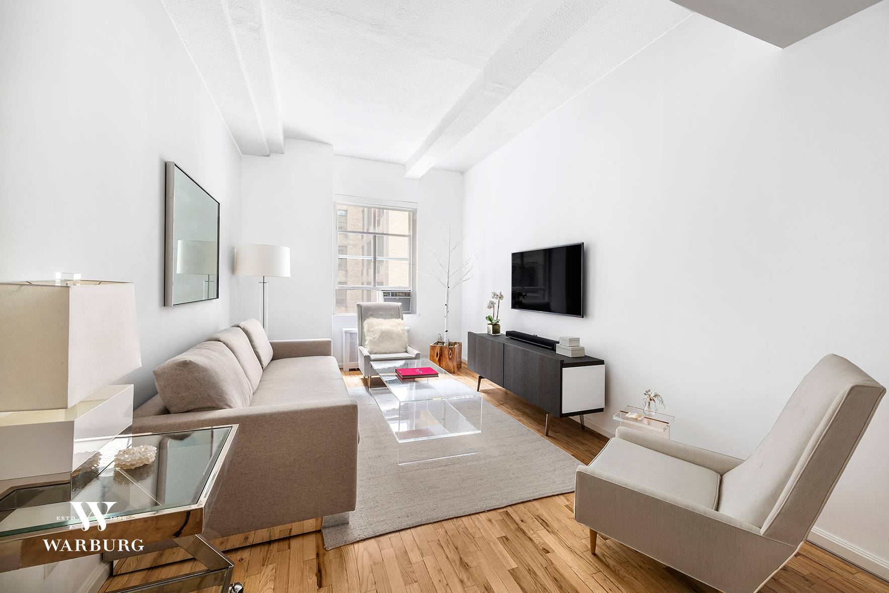 Just a block from Gramercy Park, an expertly renovated loft like 1 bedroom with oversized windows in a pre war, full service building.