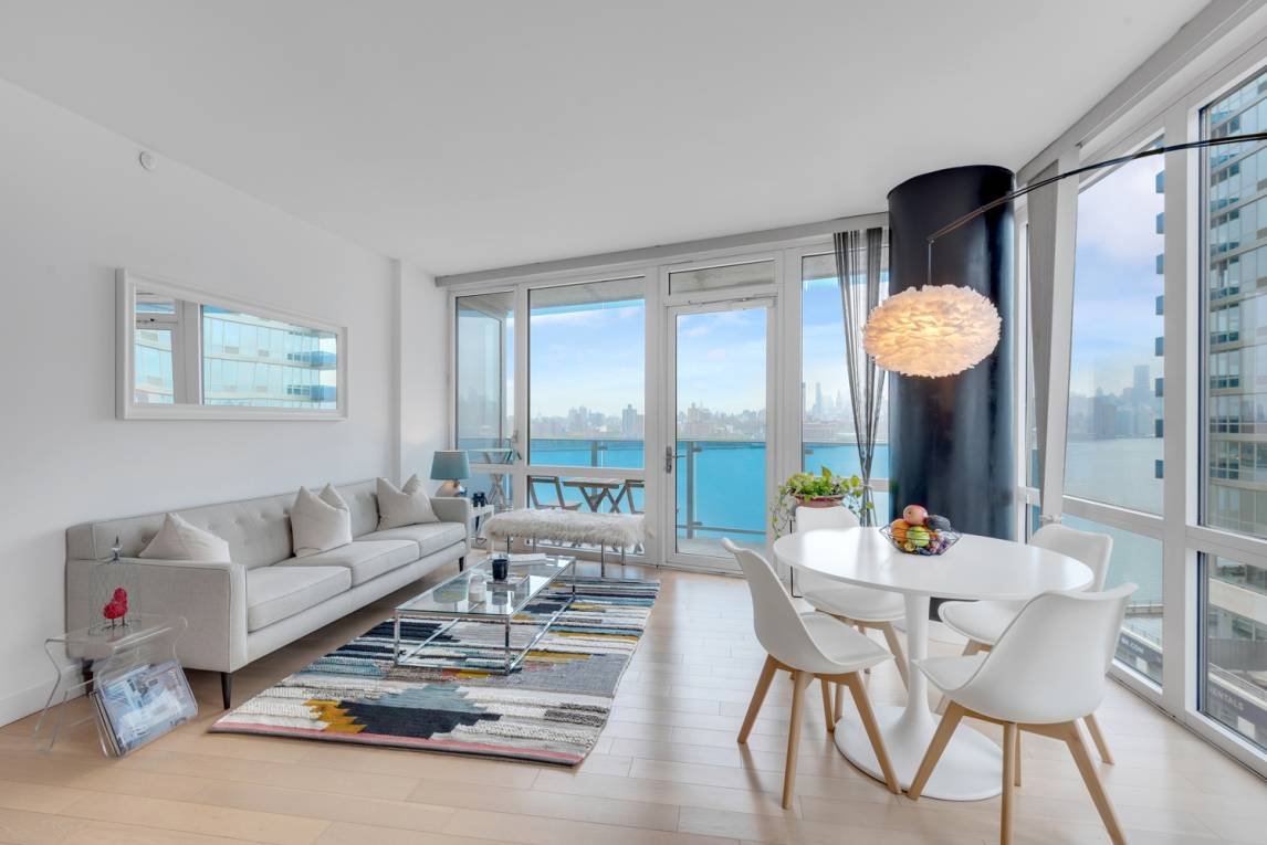 Split Two Bedroom, Two Baths Waterfront Condo with Postcard Views of Manhattan and Tax Abatement until 2036.