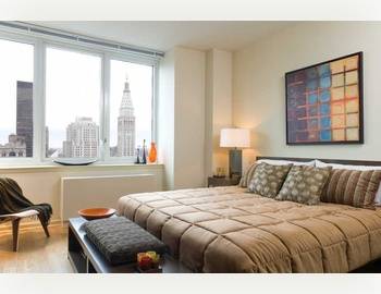 Corner 22nd Floor Alcove Studio ** Wall of Windows ** Sleeping Alcove ** Eat-In Kitchen ** Lots of Closets ** W/D ** POOl, Sauna, Rooftop Deck, Spa, Gym, Cold Storage ** Chelsea/Flatiron/Midtown